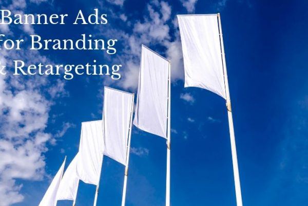 banner advertising for branding white flags flying against blue sky and clouds