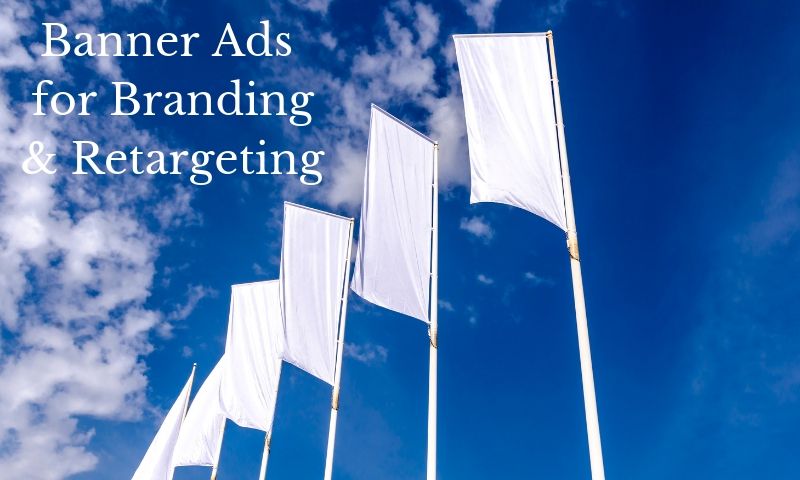 banner advertising for branding white flags flying against blue sky and clouds